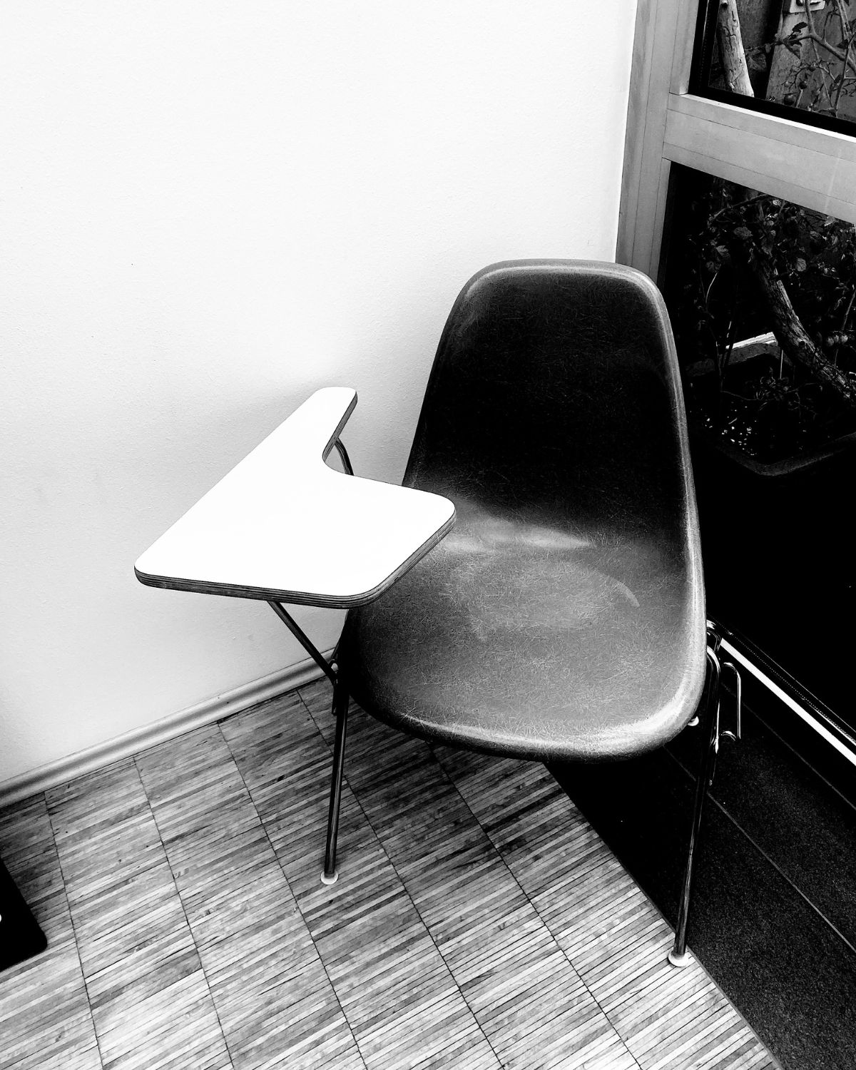 Empty chair with writing tablet